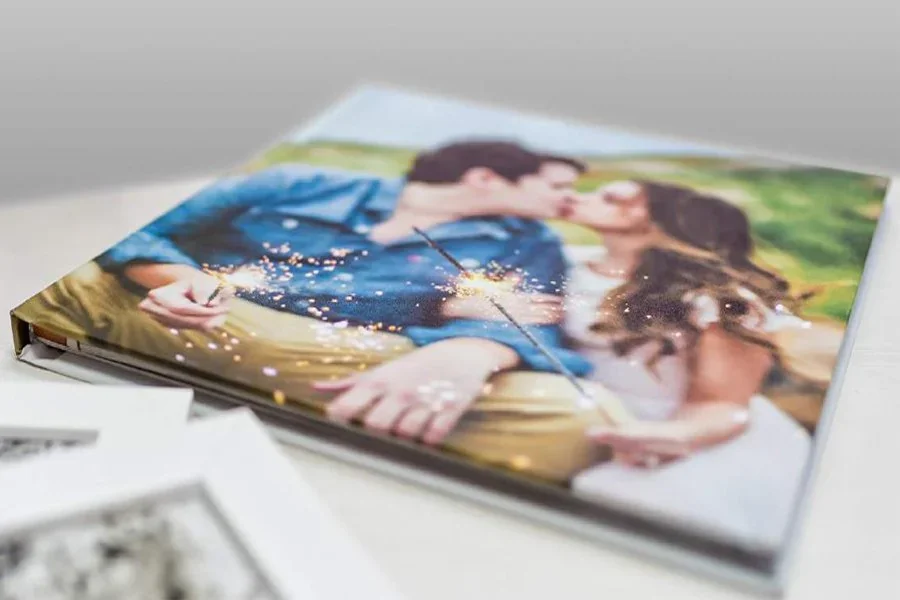 An image-wrap photo album with a couple's portrait on the cover