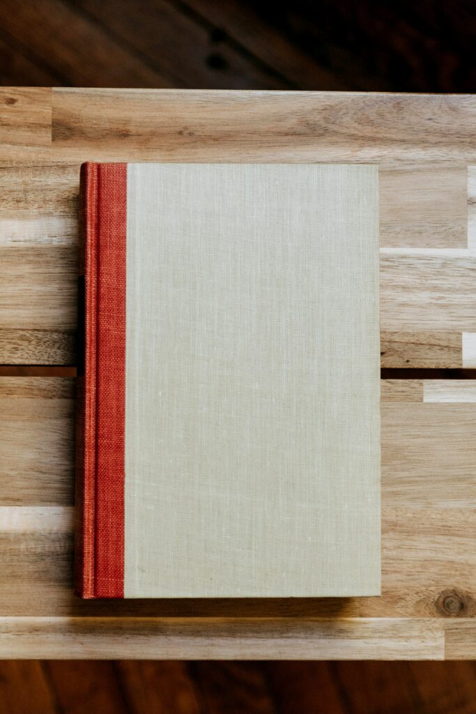 A linen-bound hardcover coffee table book