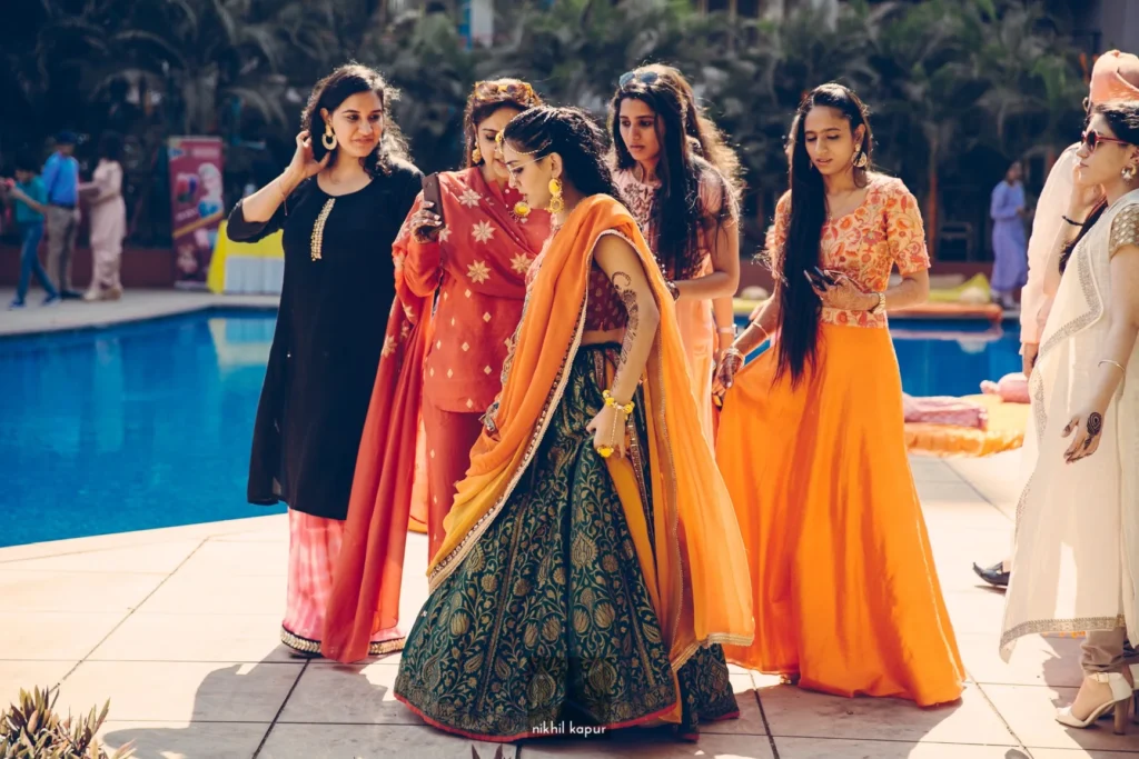 The bride and her friends by the pool at the mehendi