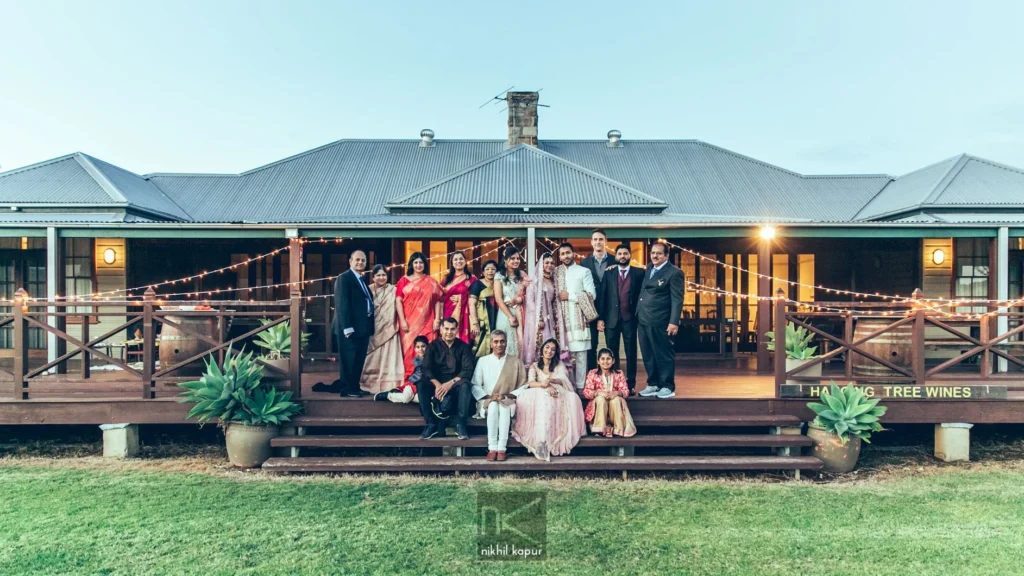 The families together on the verandah at dusk